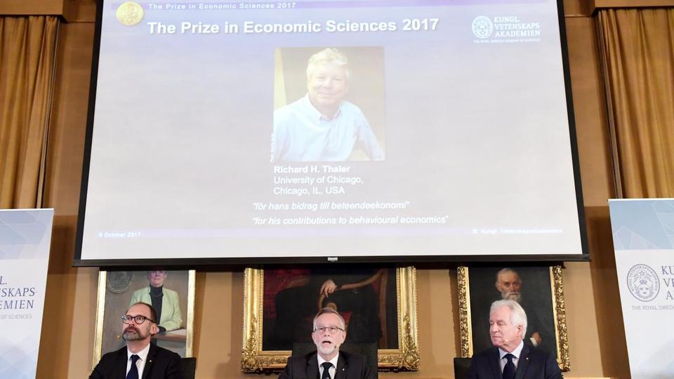 Photo of Richard H. Thaler is displayed on the screen during the announcement of the winner of the Nobel Prize in economic sciences 2017, during a press conference in Stockholm, Sweden, October 9, 2017.