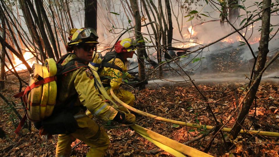 Firefighters put out a hot spot from a wildfire near Calistoga, California, US on Thursday, October 12, 2017. (Photo AP)