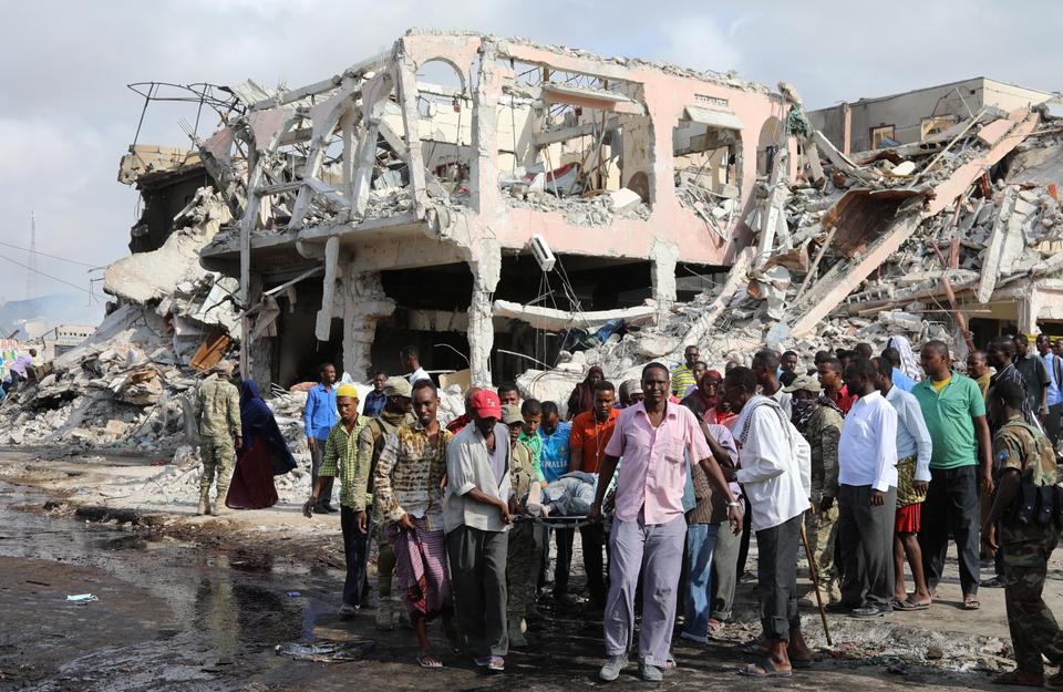 Rescue workers with flashlights overnight searched for survivors trapped under the rubble of the largely destroyed Safari Hotel, which is close to Somalia's foreign ministry. The explosion blew off metal gates and blast walls erected outside the hotel.